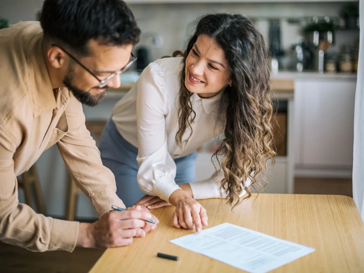 Man and woman discussing document
