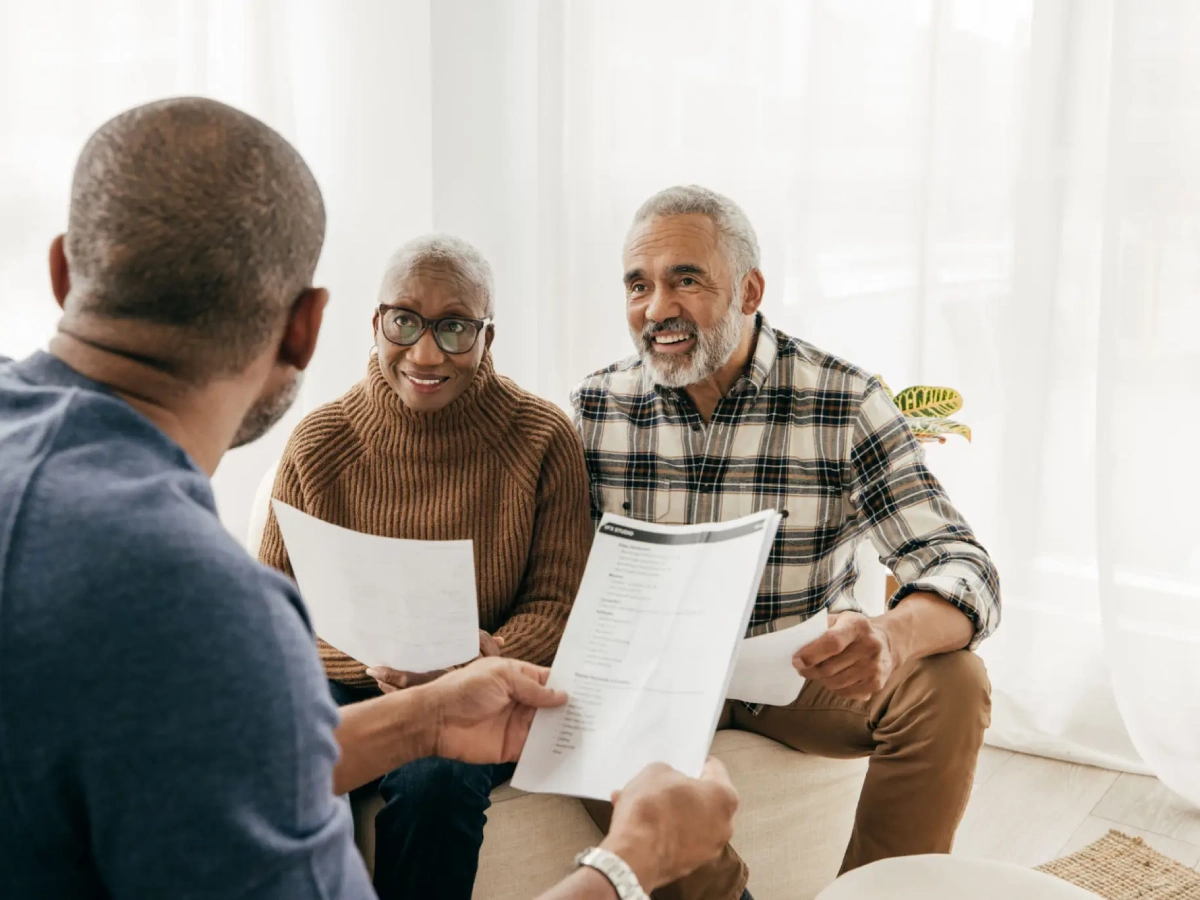 Elderly couple reviewing paperwork together