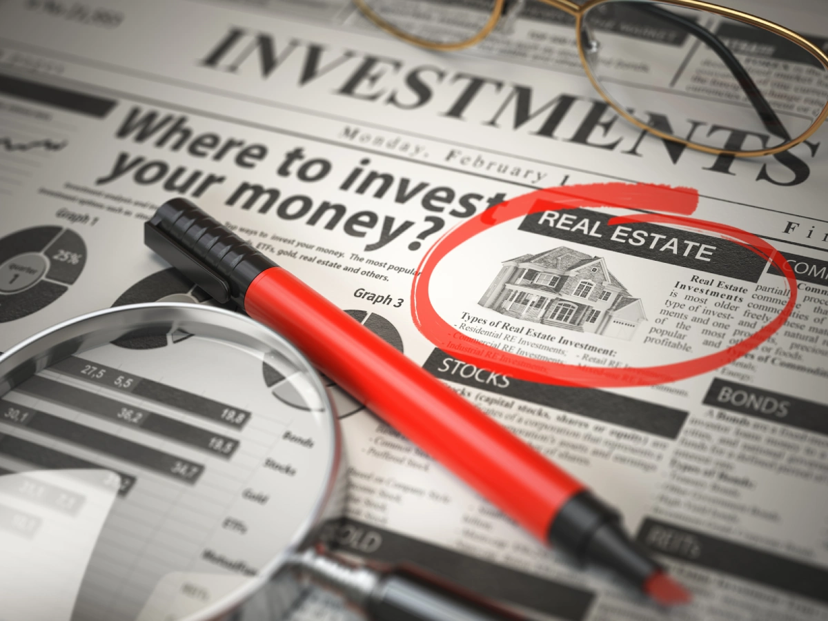 Investment article with red pen focus