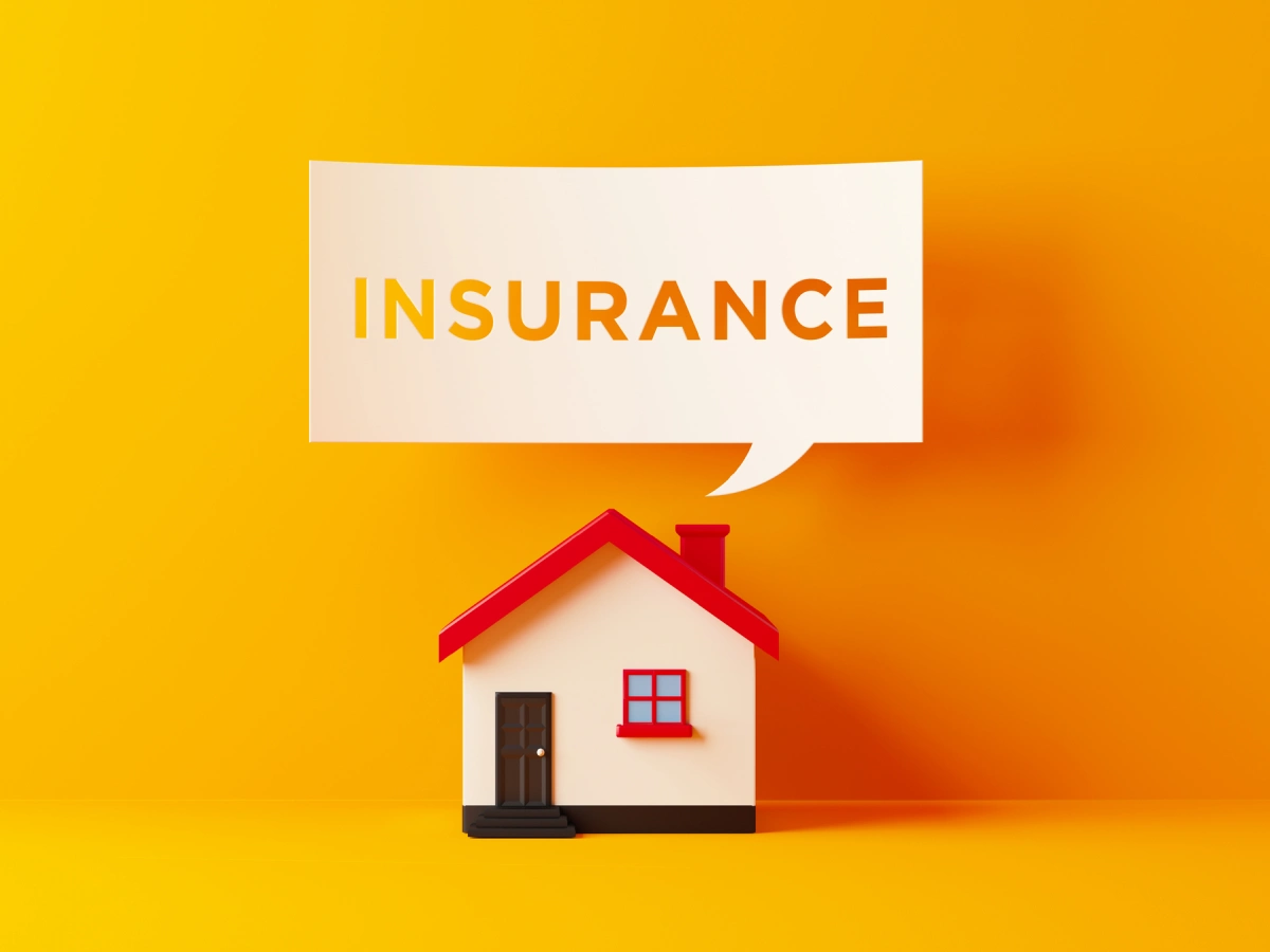 Insurance message above small house