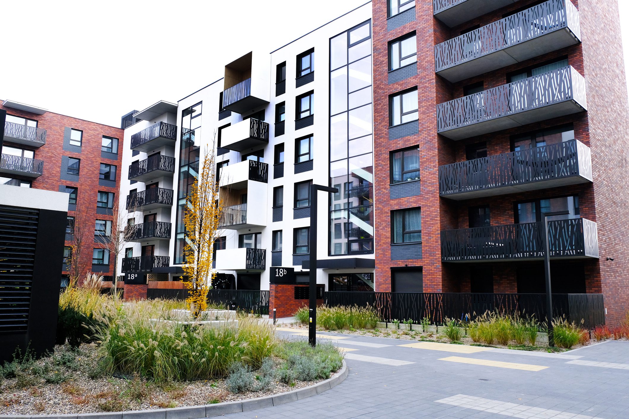 Residential buildings with balconies and greenery