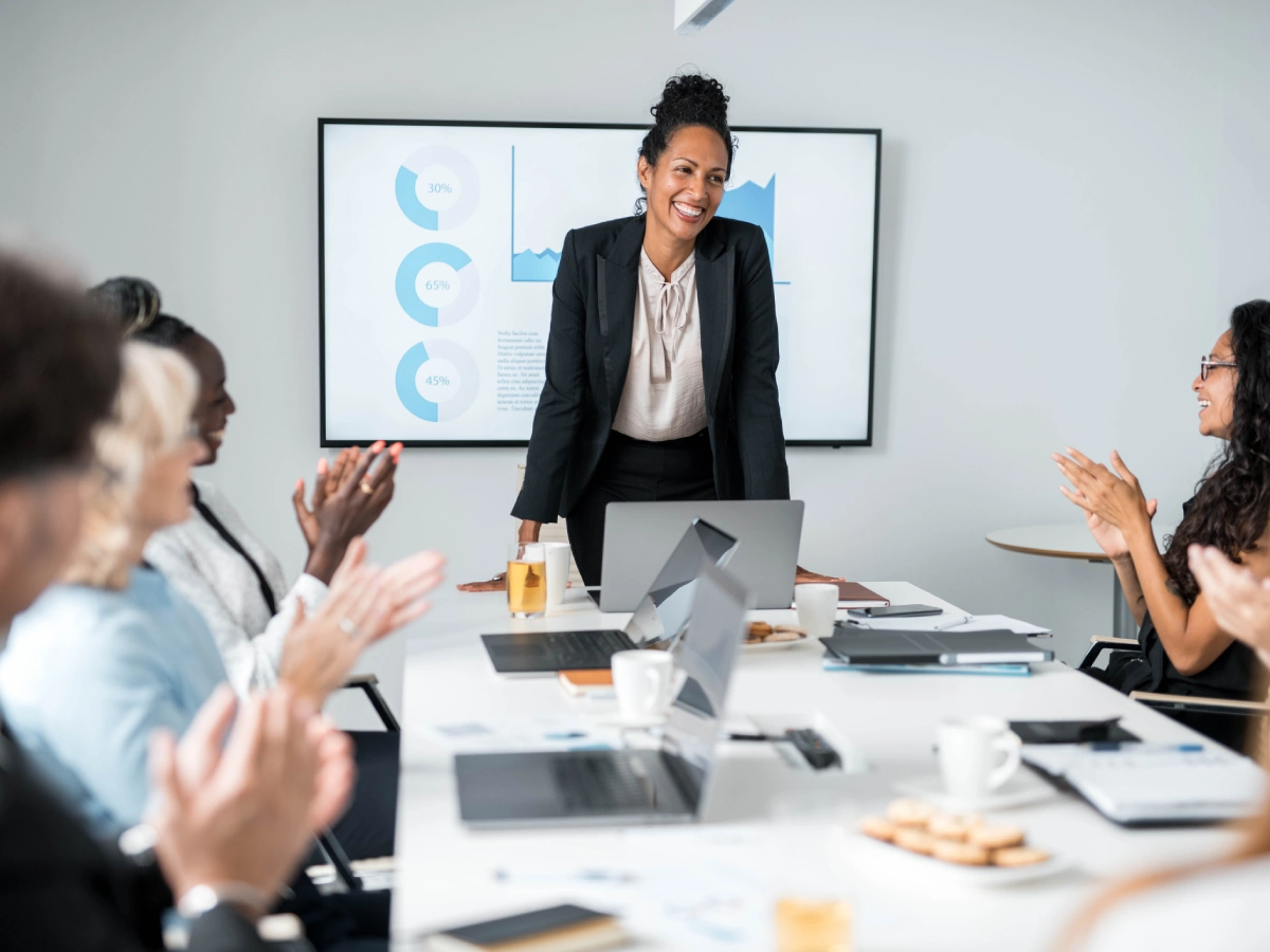 Professional woman presenting to colleagues