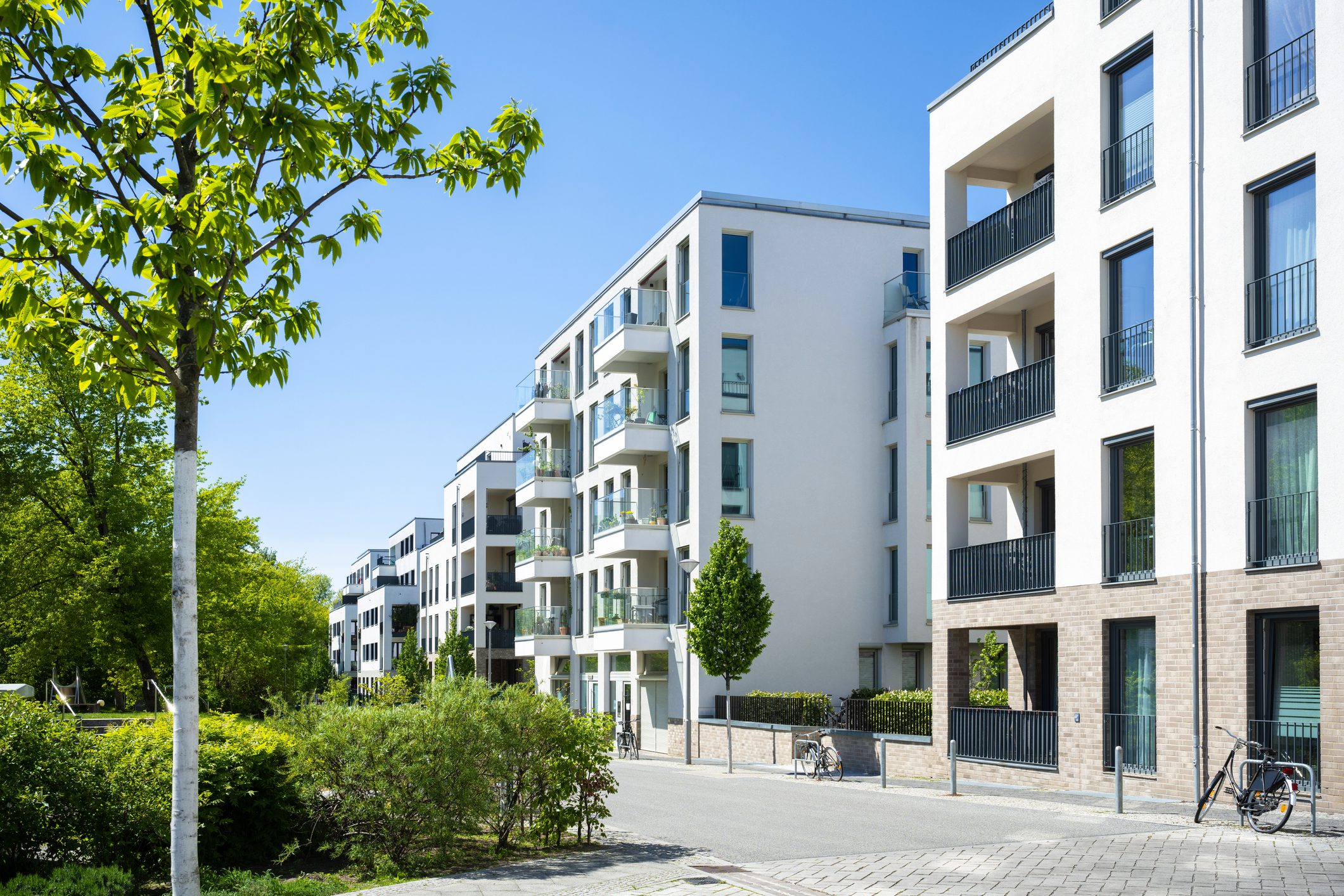 Modern apartment buildings under clear blue sky