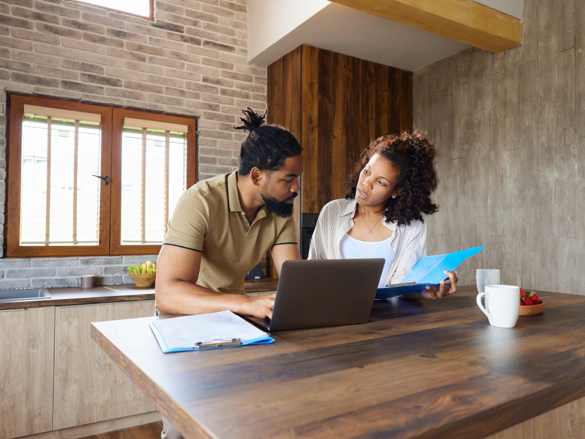 Discussing paperwork at kitchen counter