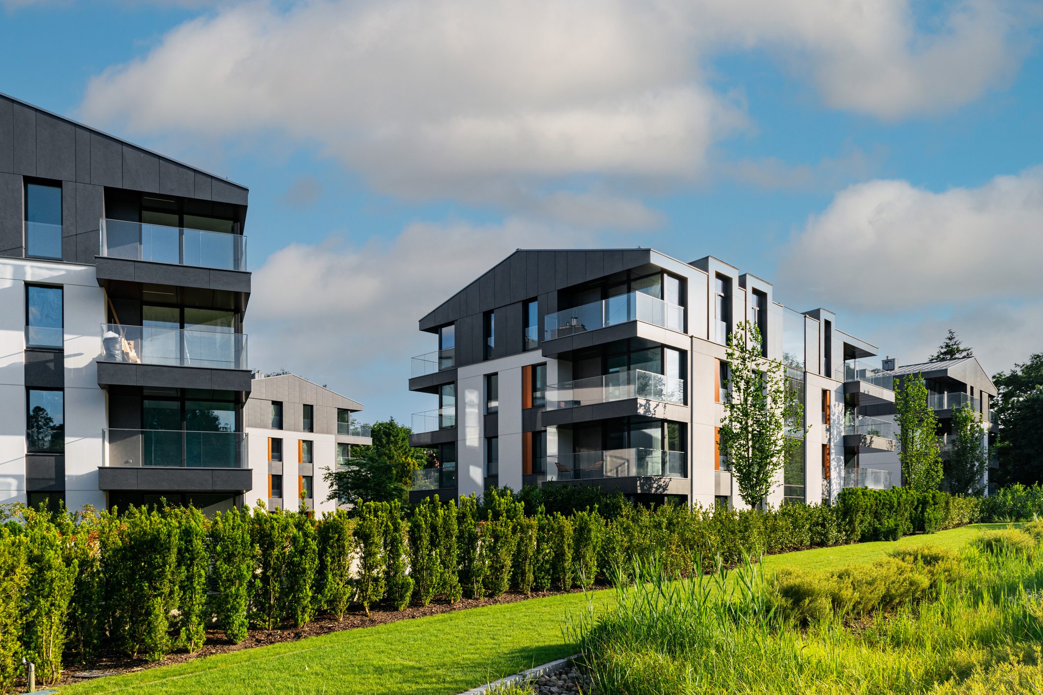Contemporary buildings surrounded by greenery