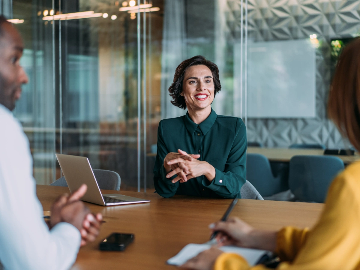 Confident woman leading work conversation