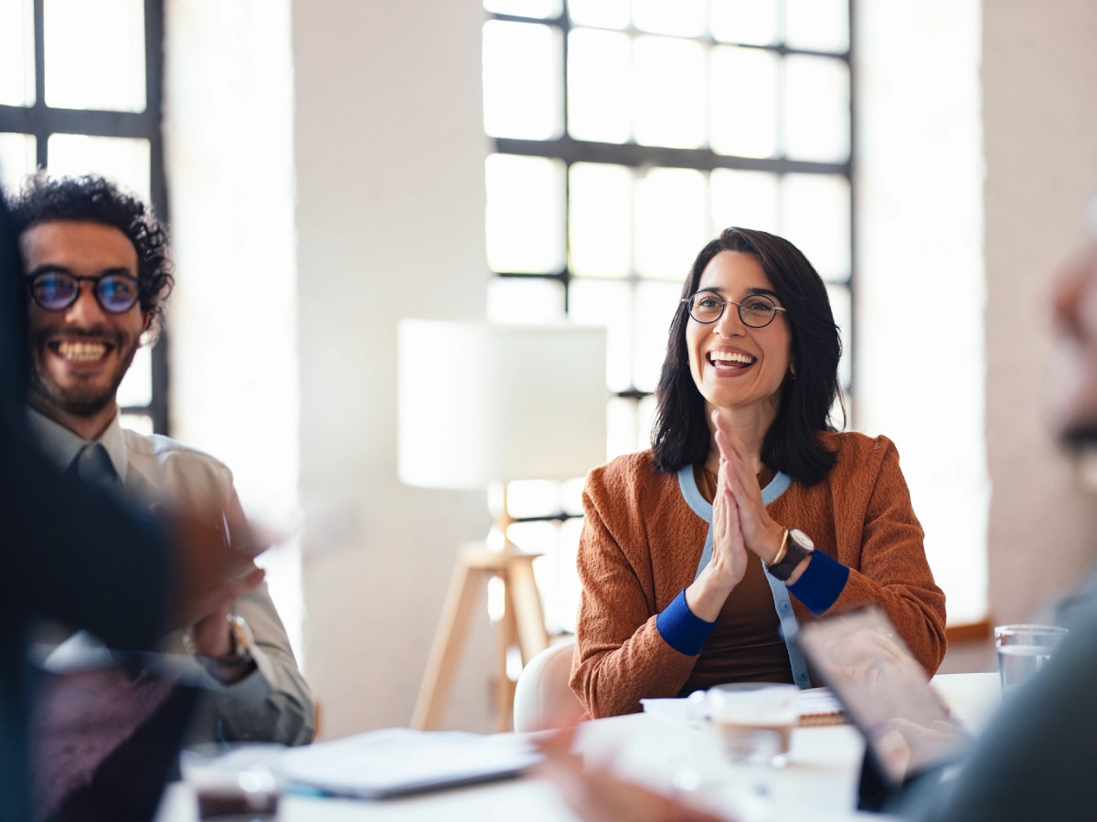 People smiling during a meeting