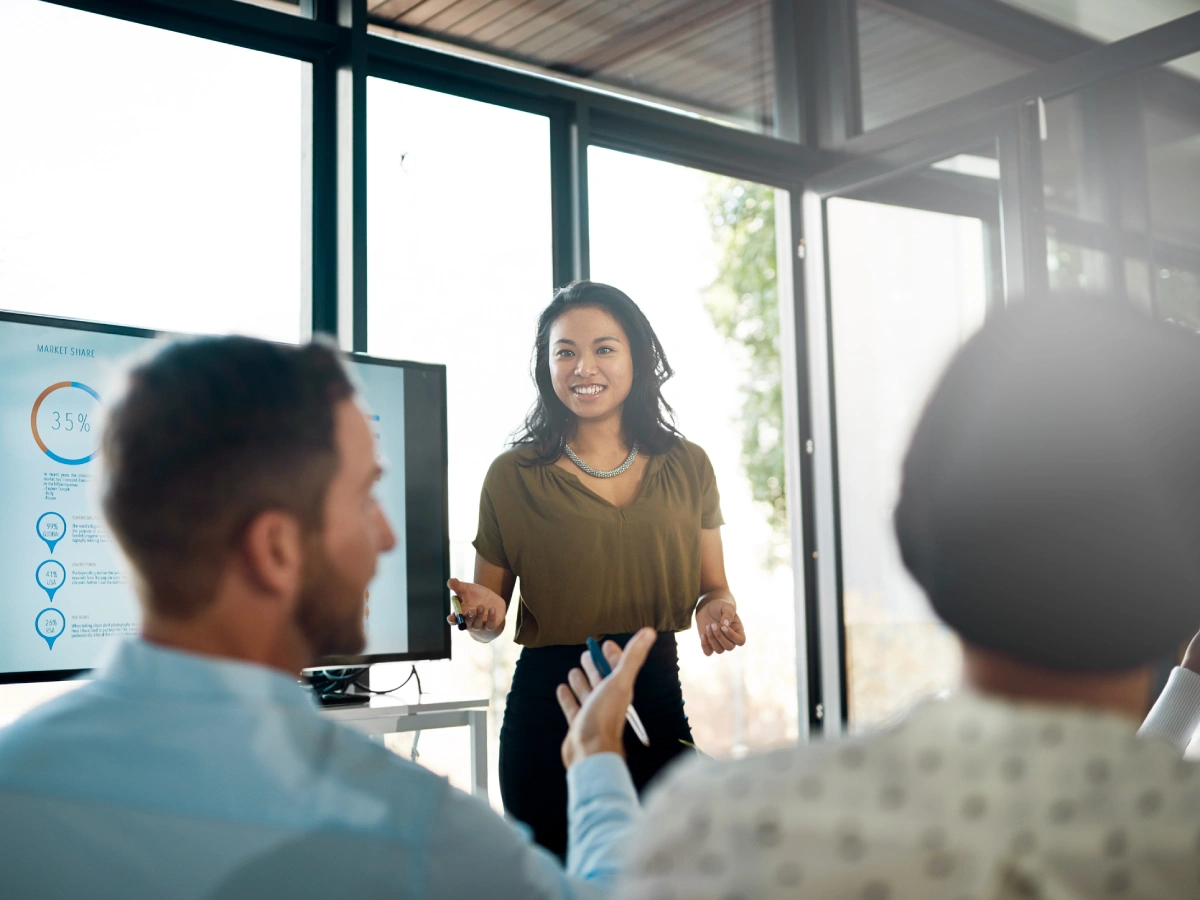 Presenter engaging with colleagues